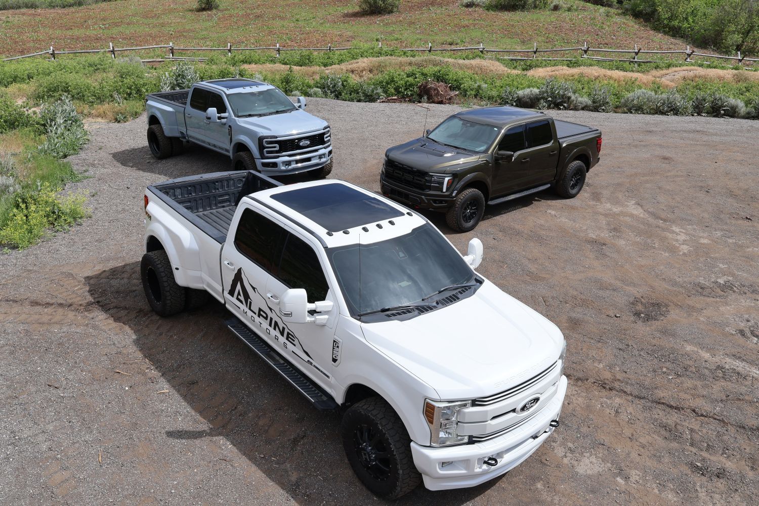 Three Ford Super Duty trucks from Alpine Motors in Provo, Utah, including an Alpine Motors branded F-350 dually